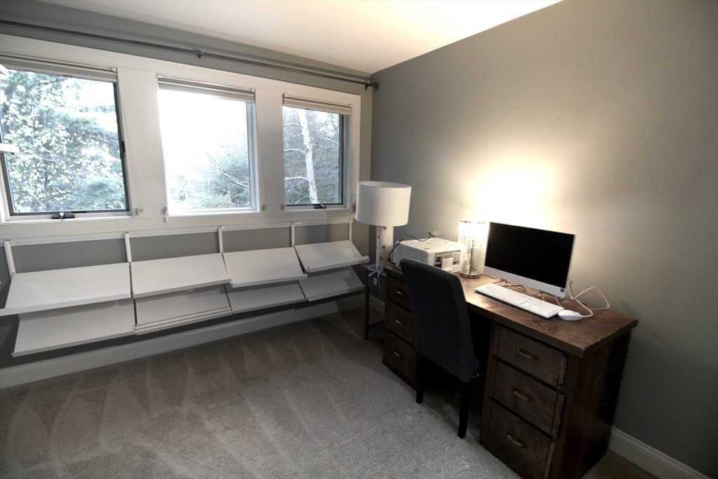 196 Country Club Way Ipswich, MA 01938 - Photo 29 of 33 a view of a workspace with furniture and a window