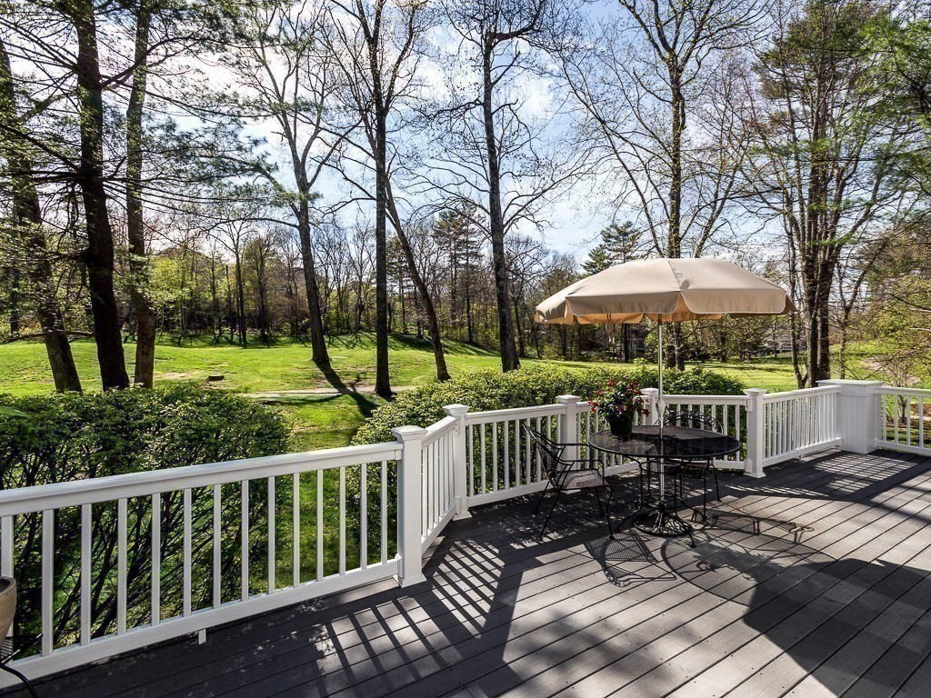 196 Country Club Way Ipswich, MA 01938 - Photo 10 of 33 a view of a wooden deck with chairs and a yard