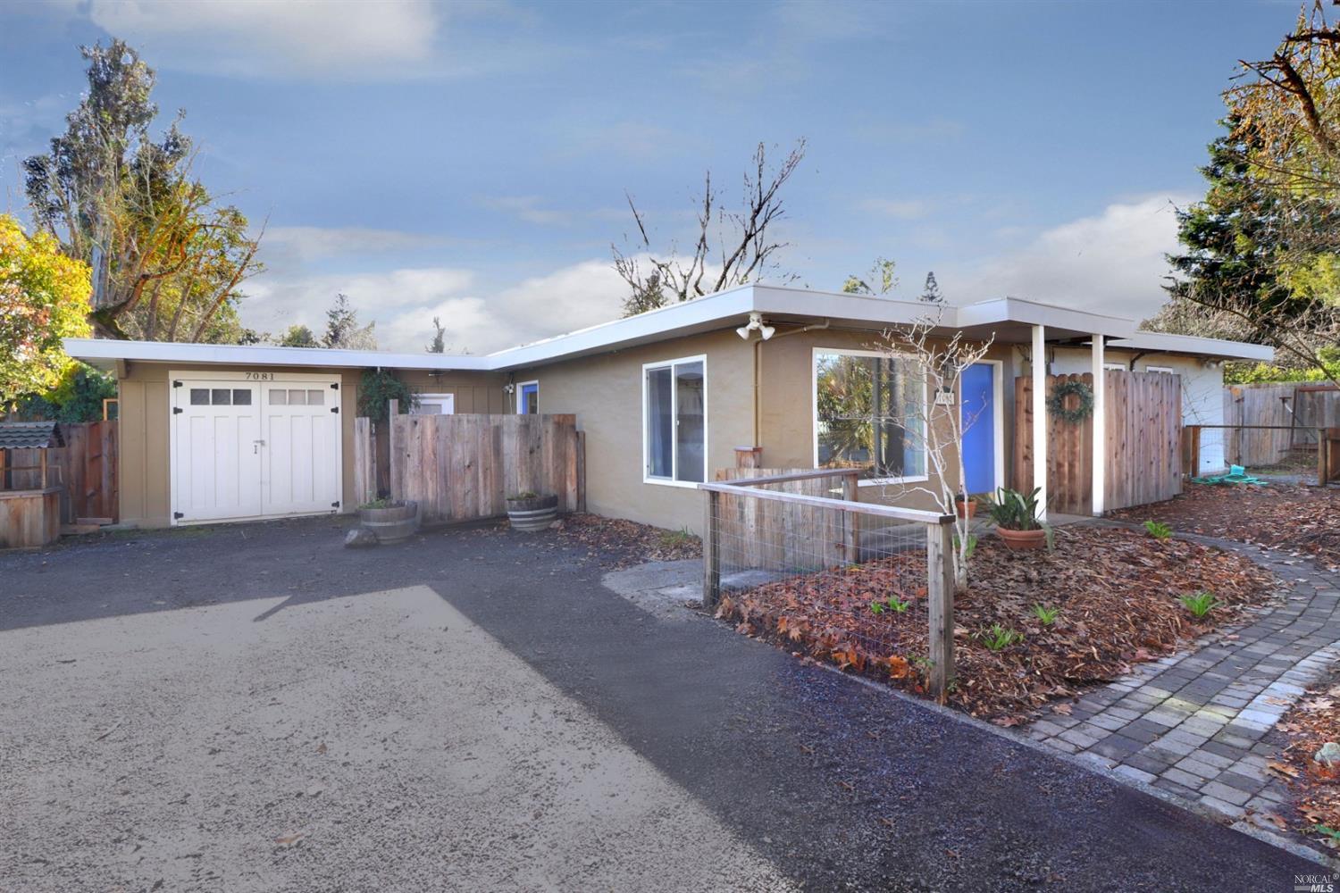 7081 Elphick Road Sebastopol, CA 95472 - Photo 1 of 1 a front view of a house with garden