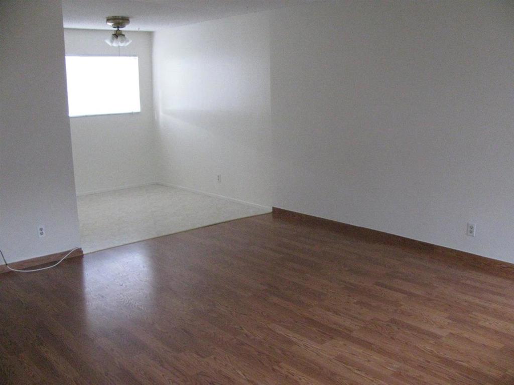 2375 Chestnut Street Livermore, CA 94551 - Photo 6 of 11 an empty room with wooden floor and windows