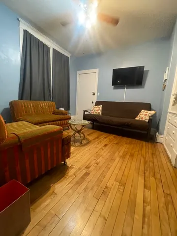 a living room with a couch and a flat screen tv