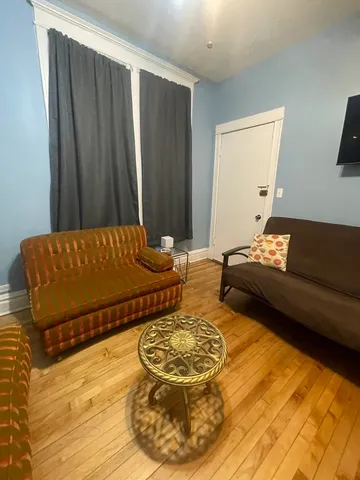 a living room with a bed