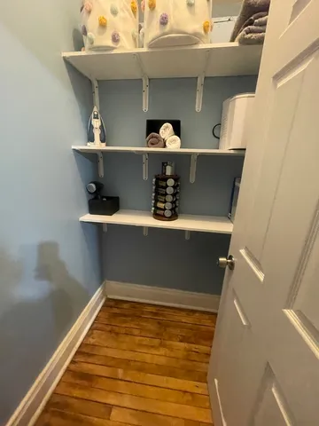 a view of cabinet with wooden floor