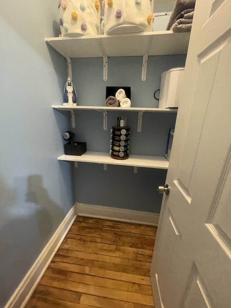 2107 West Coulter Street, Unit 1R Chicago, IL 60608 - Photo 24 of 26 a view of cabinet with wooden floor