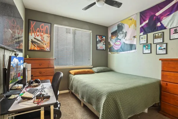 a bedroom with a bed and furniture