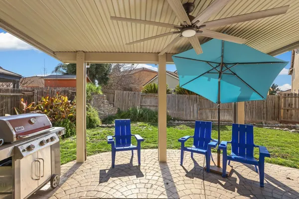 a swimming pool with outdoor seating and garden