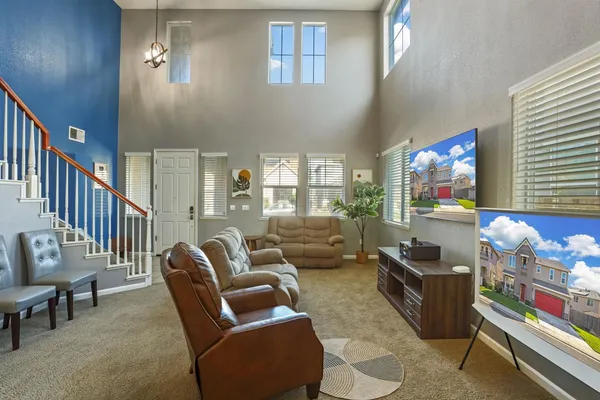 a living room with furniture fireplace and a window