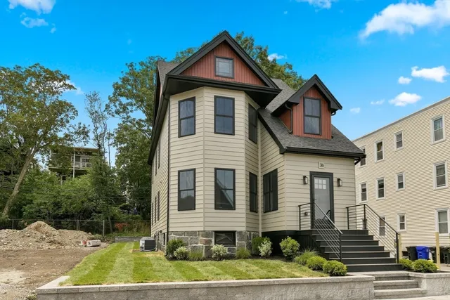 a front view of a house with a yard