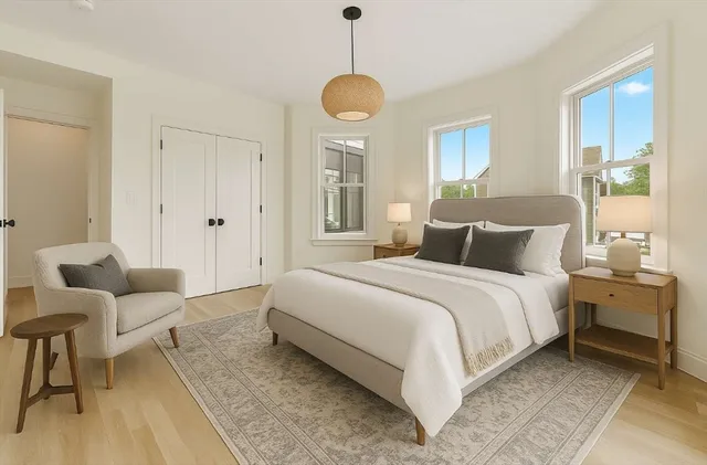 a bedroom with bed and window