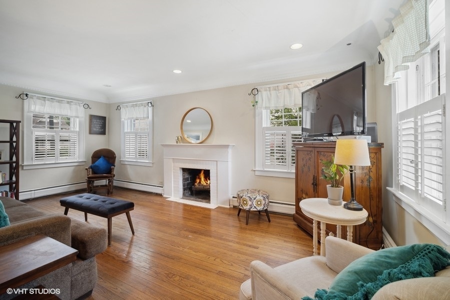 2129 Illinois Road Northbrook, IL 60062 - Photo 3 of 20 a living room with furniture and a fireplace