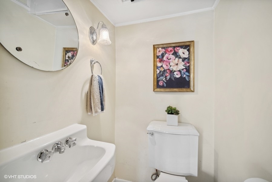 2129 Illinois Road Northbrook, IL 60062 - Photo 8 of 20 a bathroom with a sink and a mirror