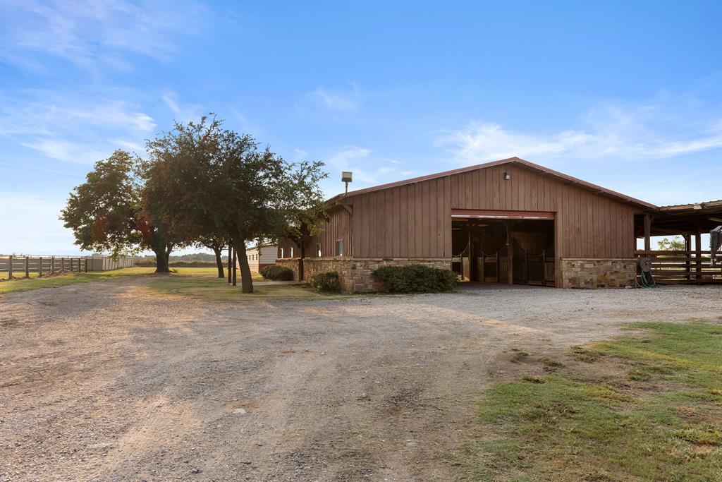 789 Stiles Road, Unit 789 Whitesboro, TX 76273 - Photo 24 of 34 a front view of house with yard and trees