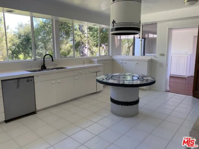 a view of a bathroom with a sink and a window