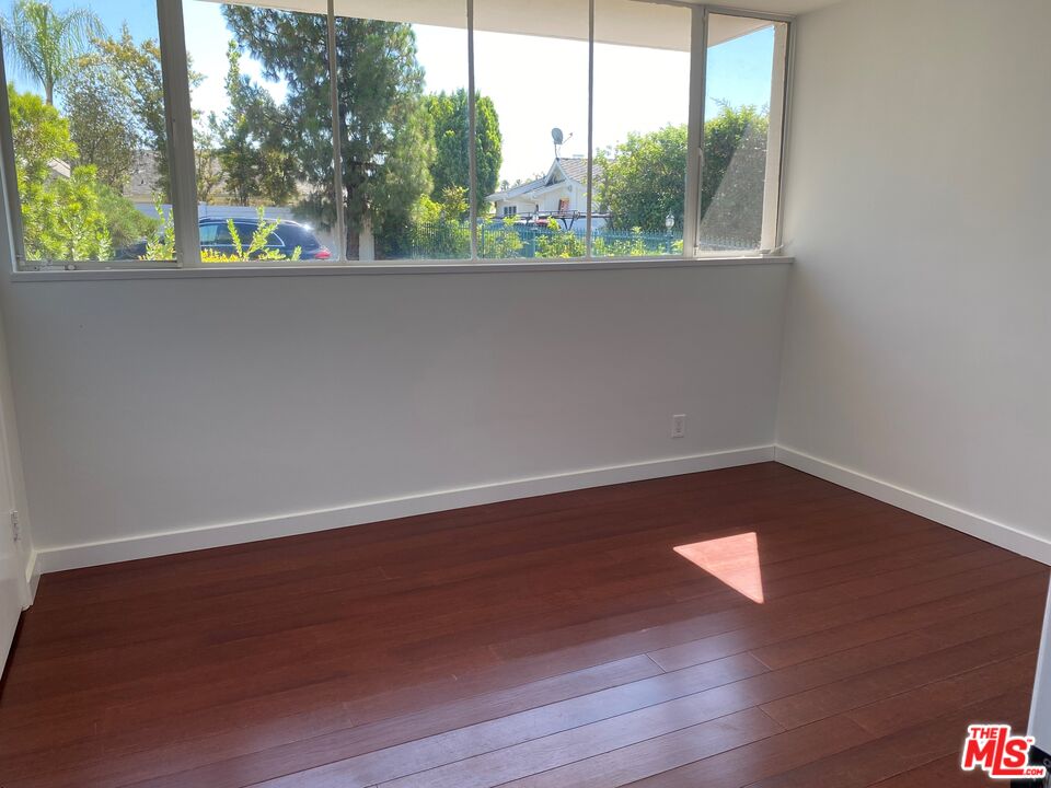 4014 Rogen Drive Encino, CA 91436 - Photo 19 of 22 a view of a small space with wooden floor and a window