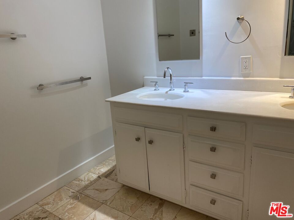 4014 Rogen Drive Encino, CA 91436 - Photo 22 of 22 a bathroom with a sink and a mirror