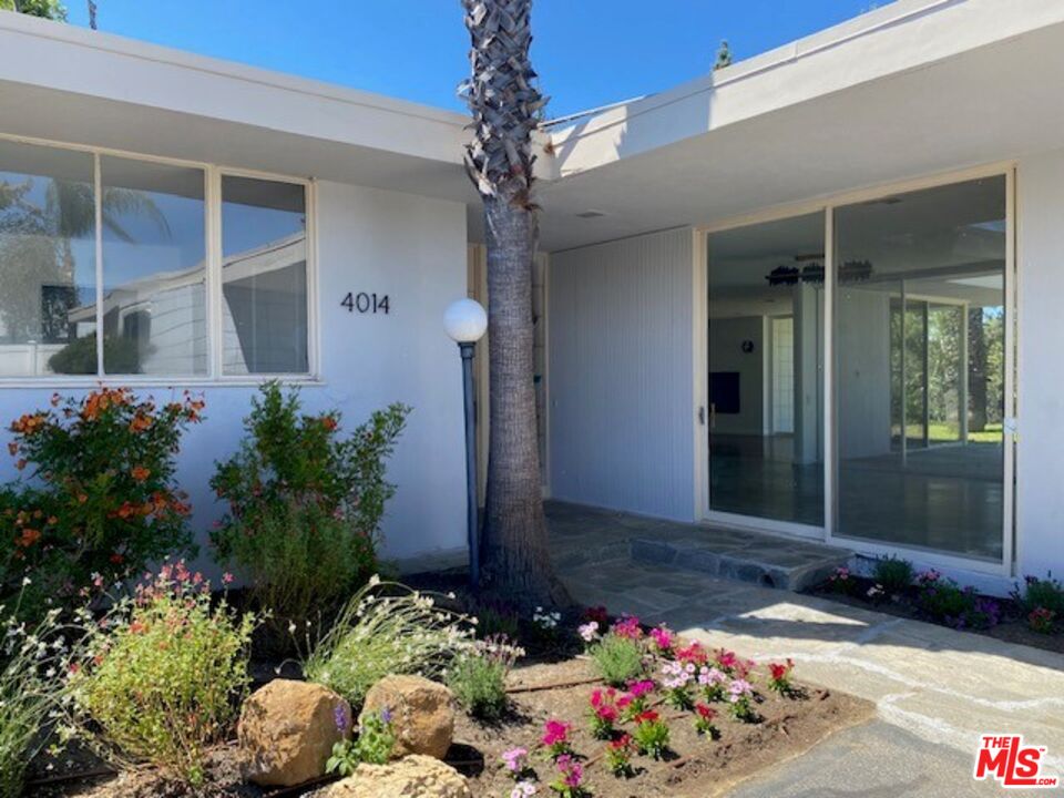 4014 Rogen Drive Encino, CA 91436 - Photo 3 of 22 a bunch of flowers in front of the house