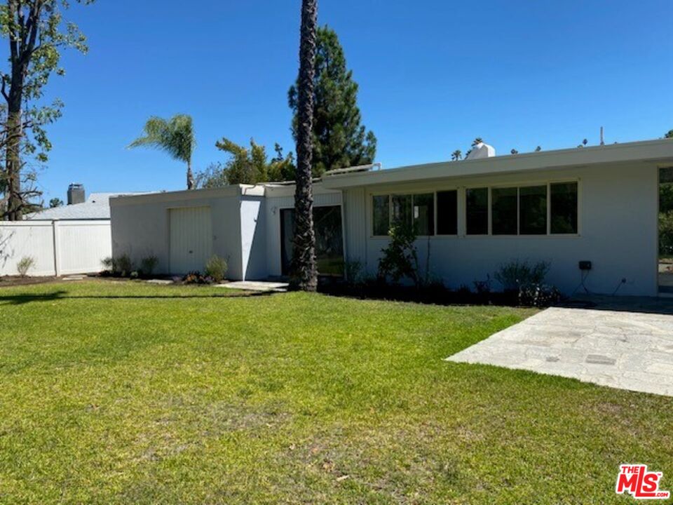 4014 Rogen Drive Encino, CA 91436 - Photo 8 of 22 a front view of a house with a garden