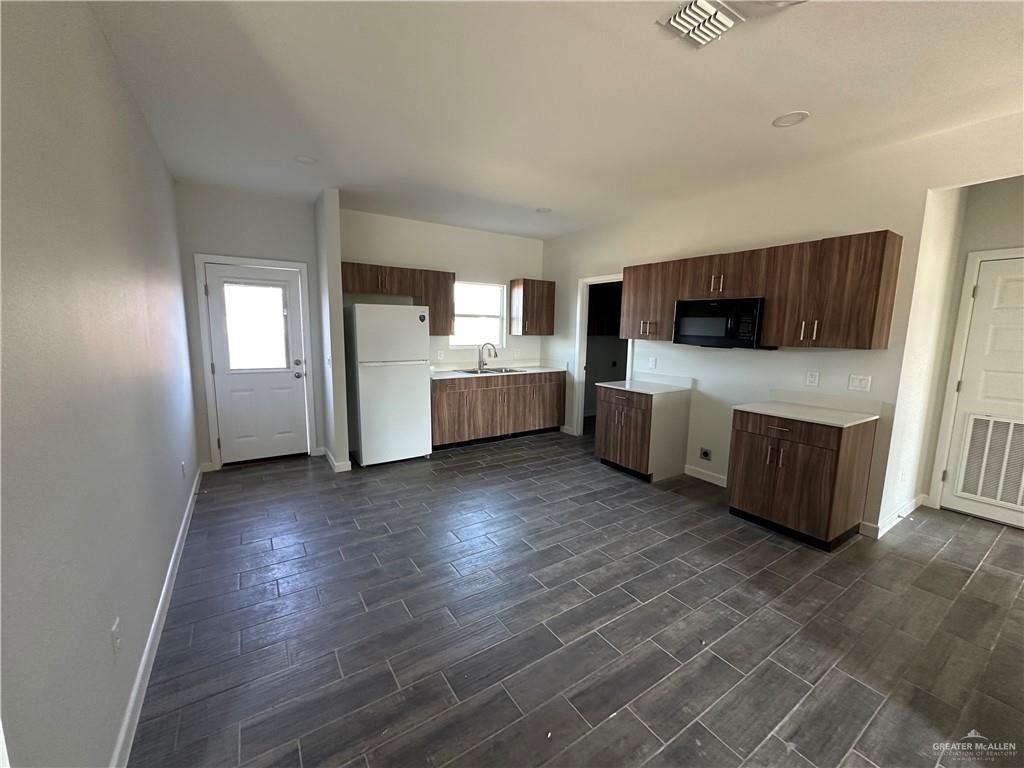 1703 Unity Drive Mercedes, TX 78570 - Photo 3 of 10 a living room with furniture and a flat screen tv