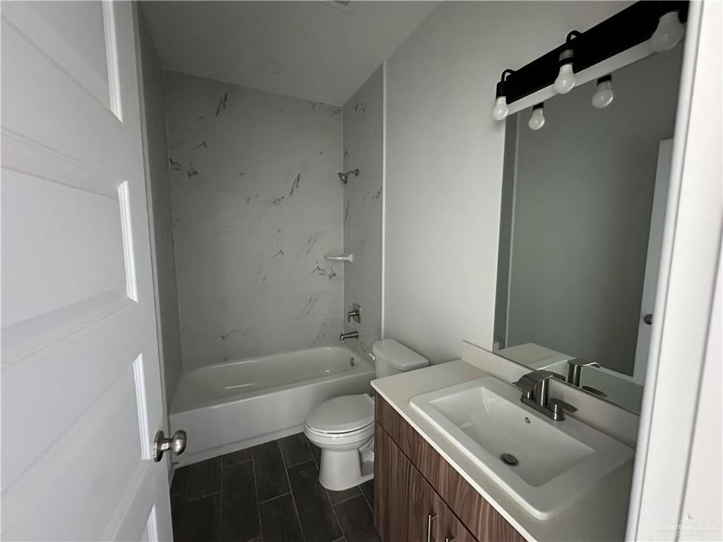 1703 Unity Drive Mercedes, TX 78570 - Photo 8 of 10 a bathroom with a sink toilet and shower