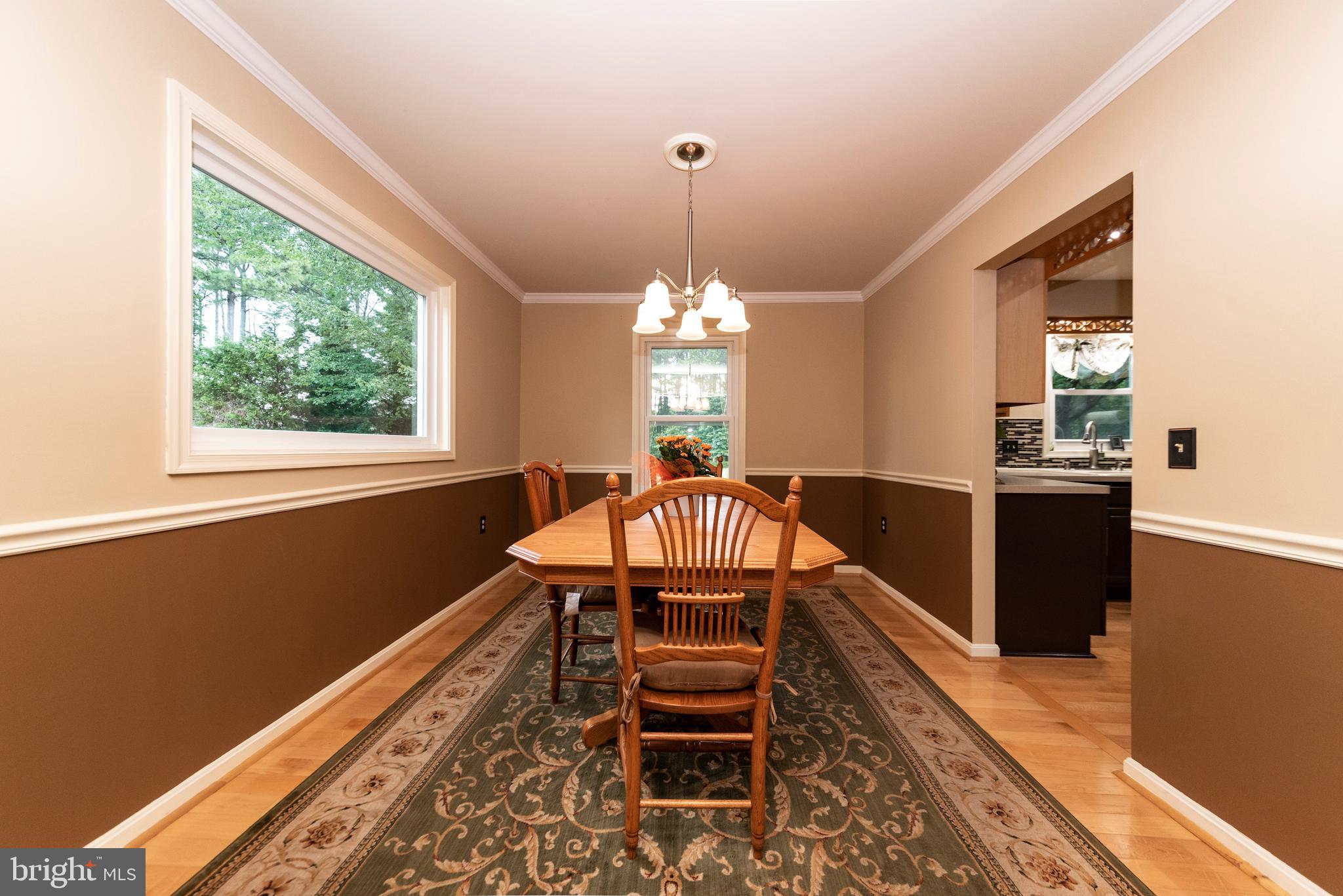 116 Hopkins Road Chester, MD 21619 - Photo 17 of 50 Forma Dining room with chair rail & crown moulding