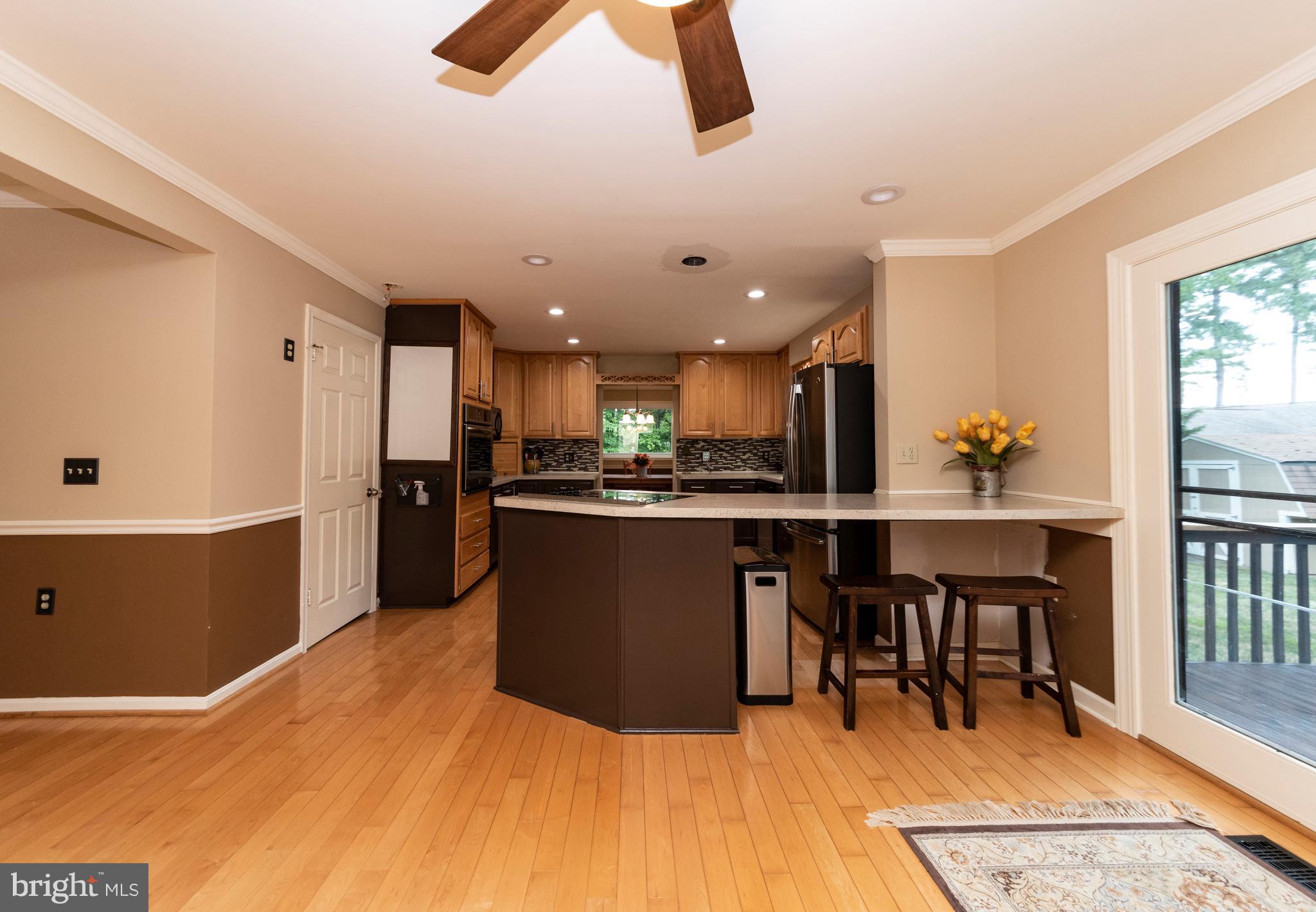 116 Hopkins Road Chester, MD 21619 - Photo 20 of 50 Kitchen with cooktop and breakfast bar