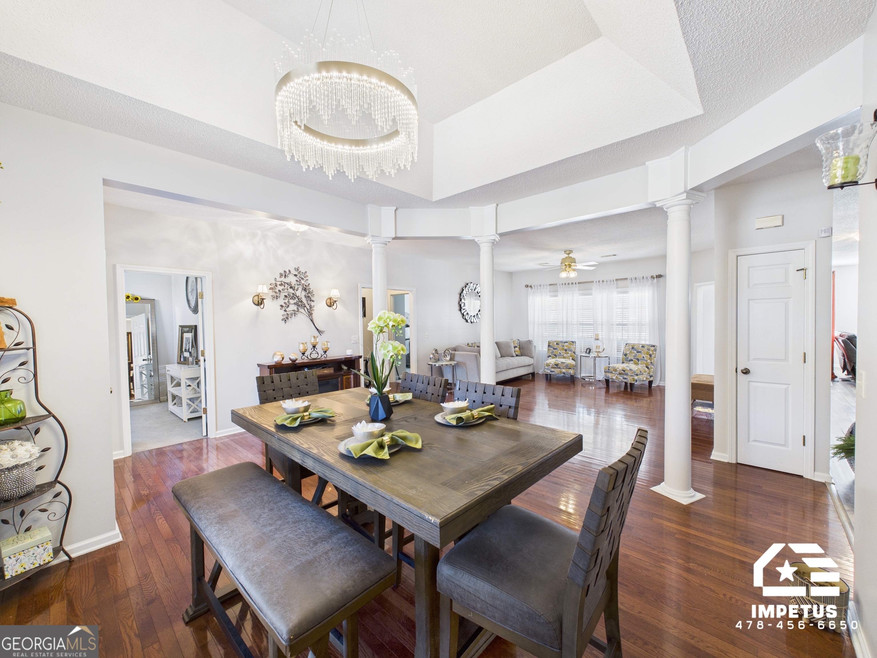 100 Crystal Ridge Road Northwest Milledgeville, GA 31061 - Photo 13 of 53 a dining room with furniture a rug and wooden floor
