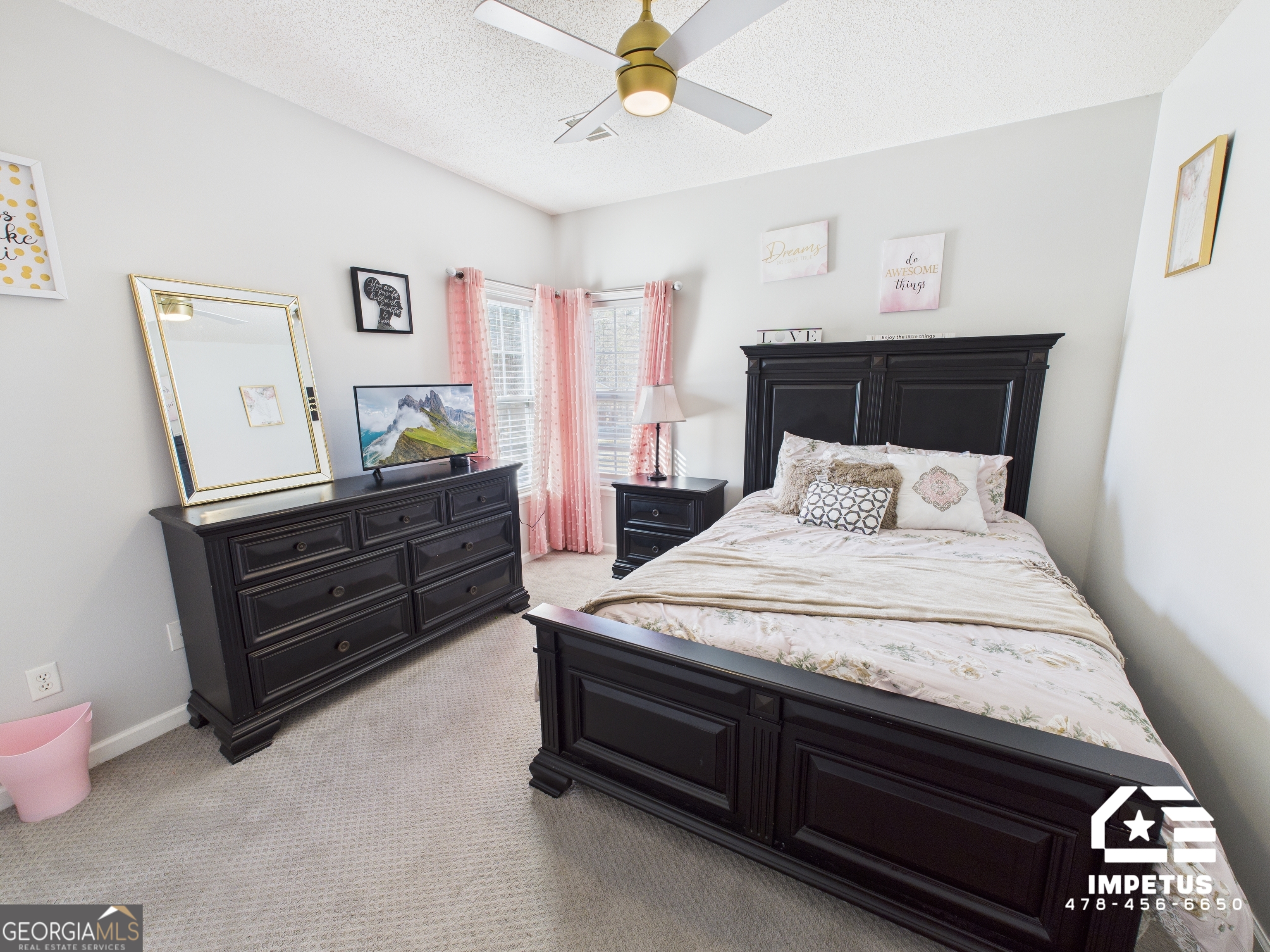 100 Crystal Ridge Road Northwest Milledgeville, GA 31061 - Photo 14 of 53 a bedroom with a bed and a dresser