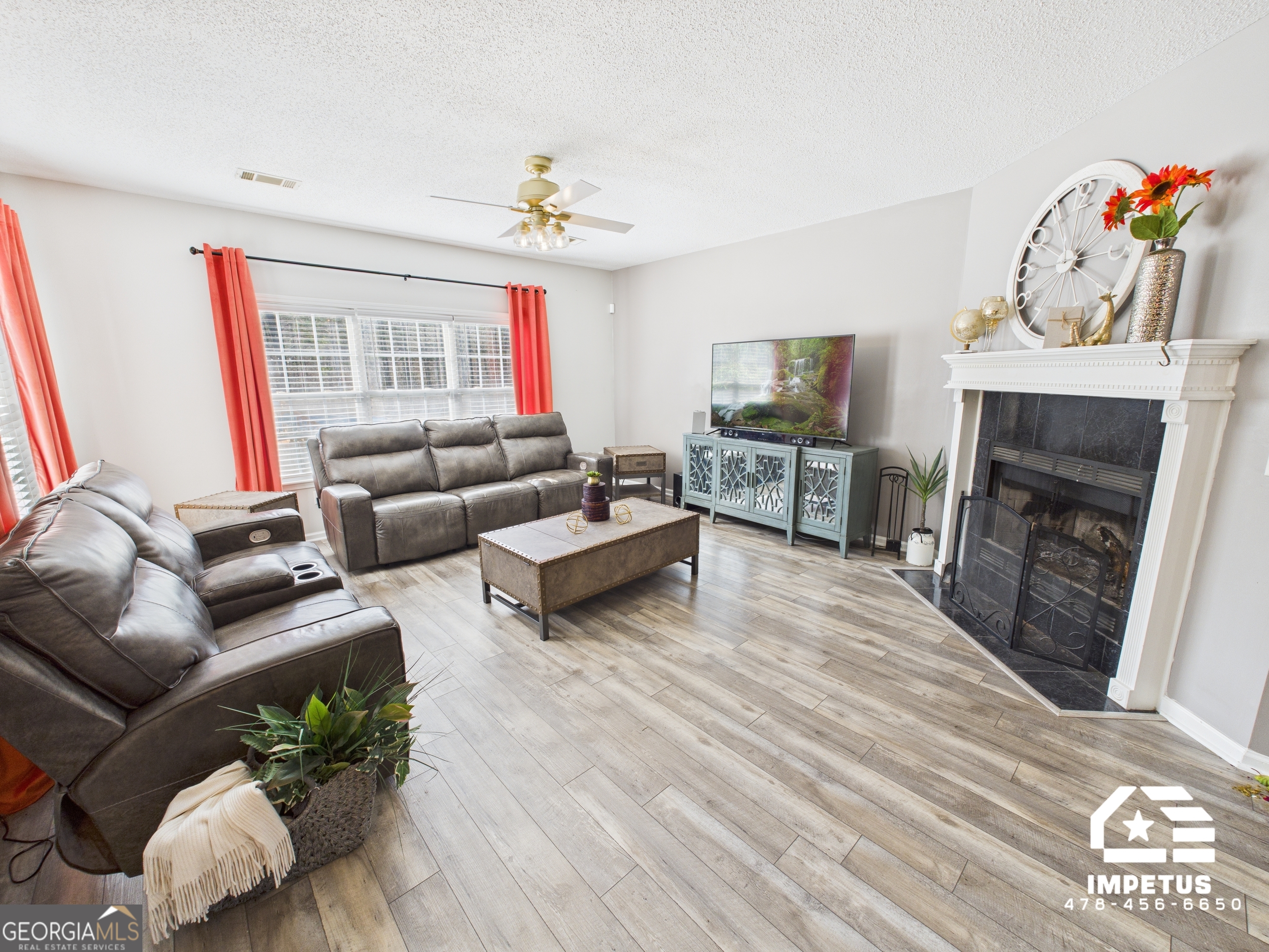 100 Crystal Ridge Road Northwest Milledgeville, GA 31061 - Photo 20 of 53 a living room with furniture and a fireplace