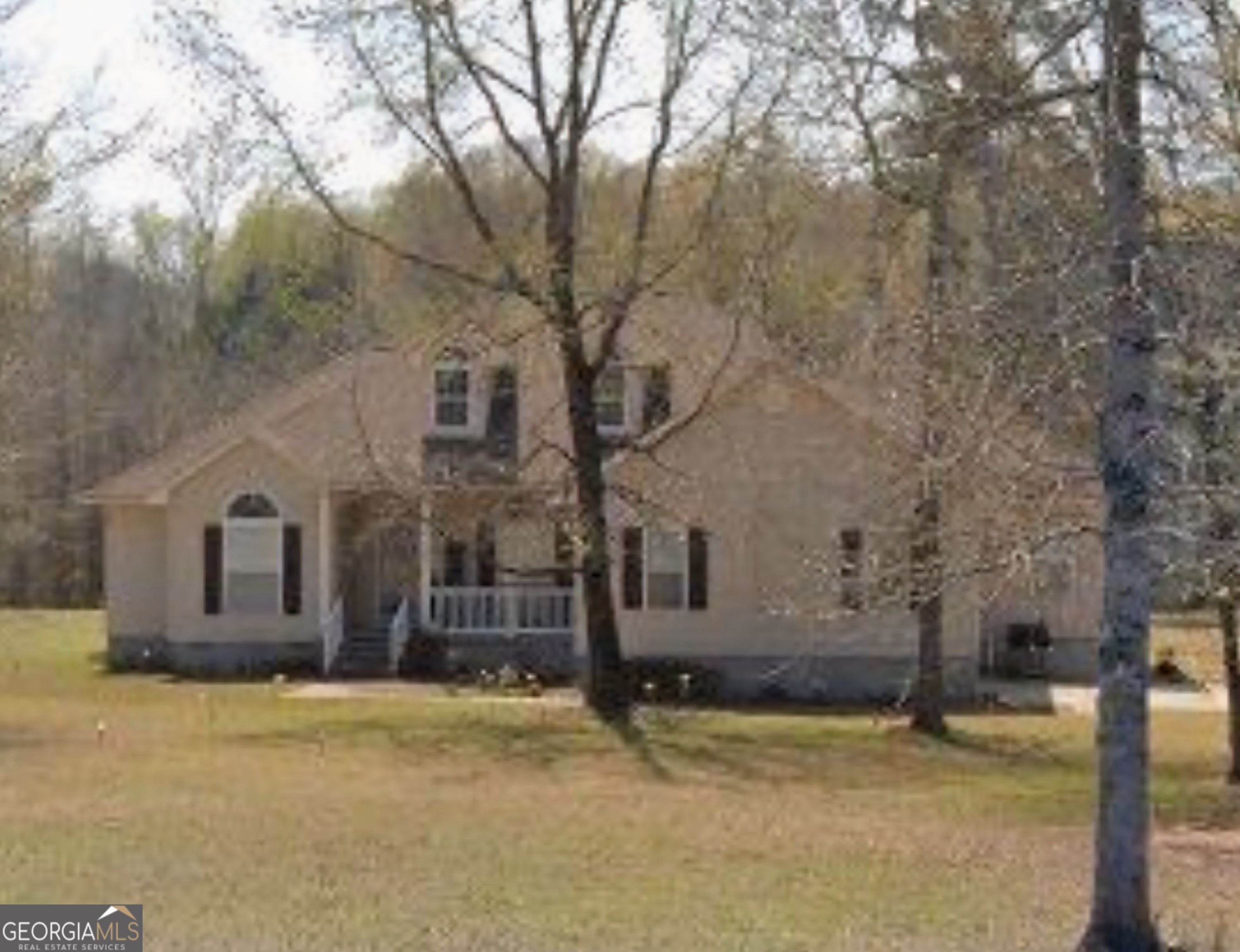 100 Crystal Ridge Road Northwest Milledgeville, GA 31061 - Photo 2 of 53 a front view of a house with a yard