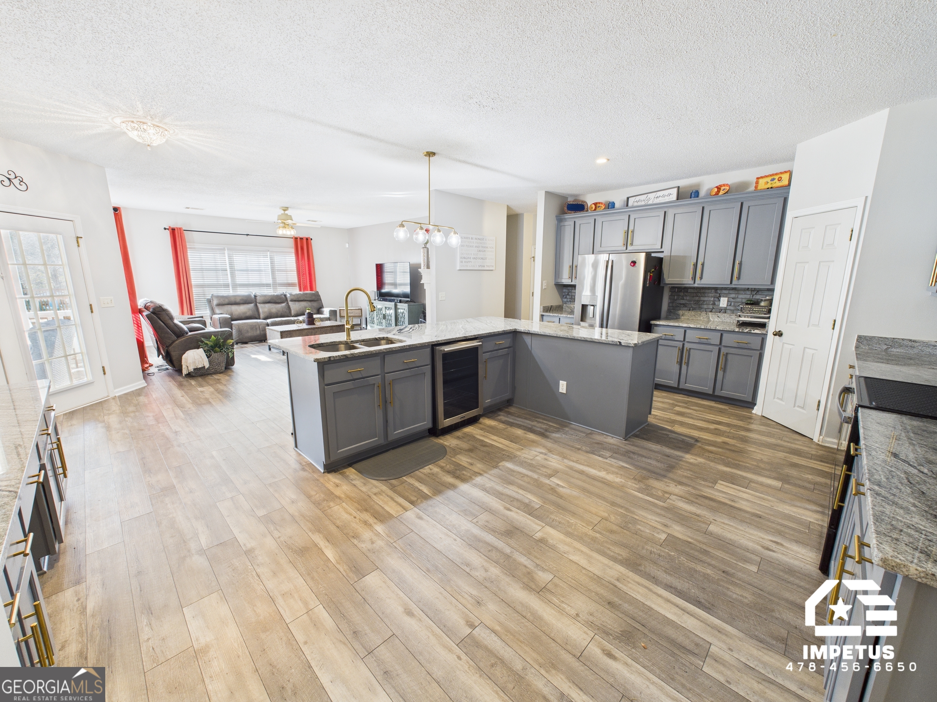 100 Crystal Ridge Road Northwest Milledgeville, GA 31061 - Photo 3 of 53 a kitchen with a sink cabinets and wooden floor