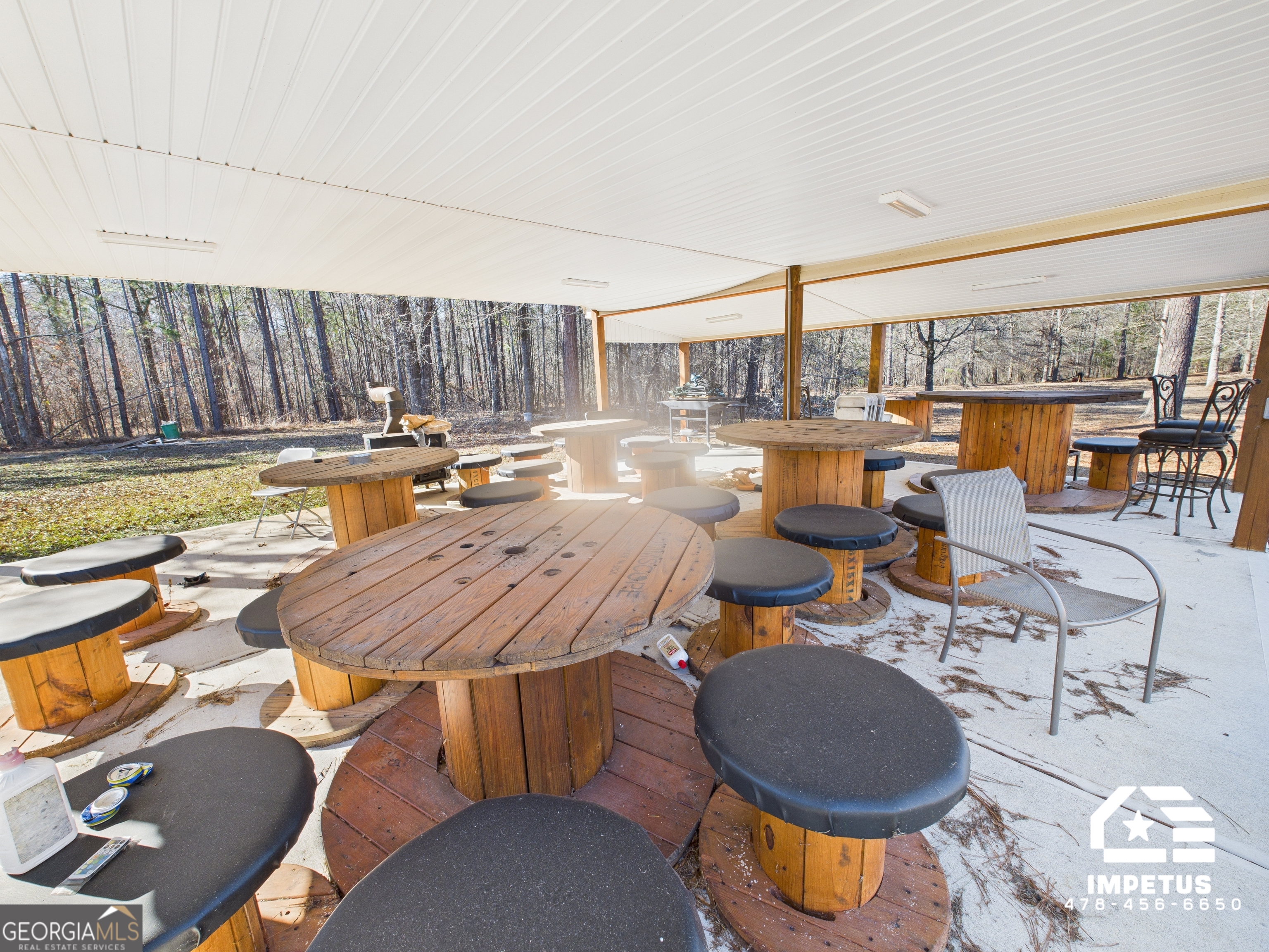100 Crystal Ridge Road Northwest Milledgeville, GA 31061 - Photo 50 of 53 an outdoor space with patio furniture and wooden floor