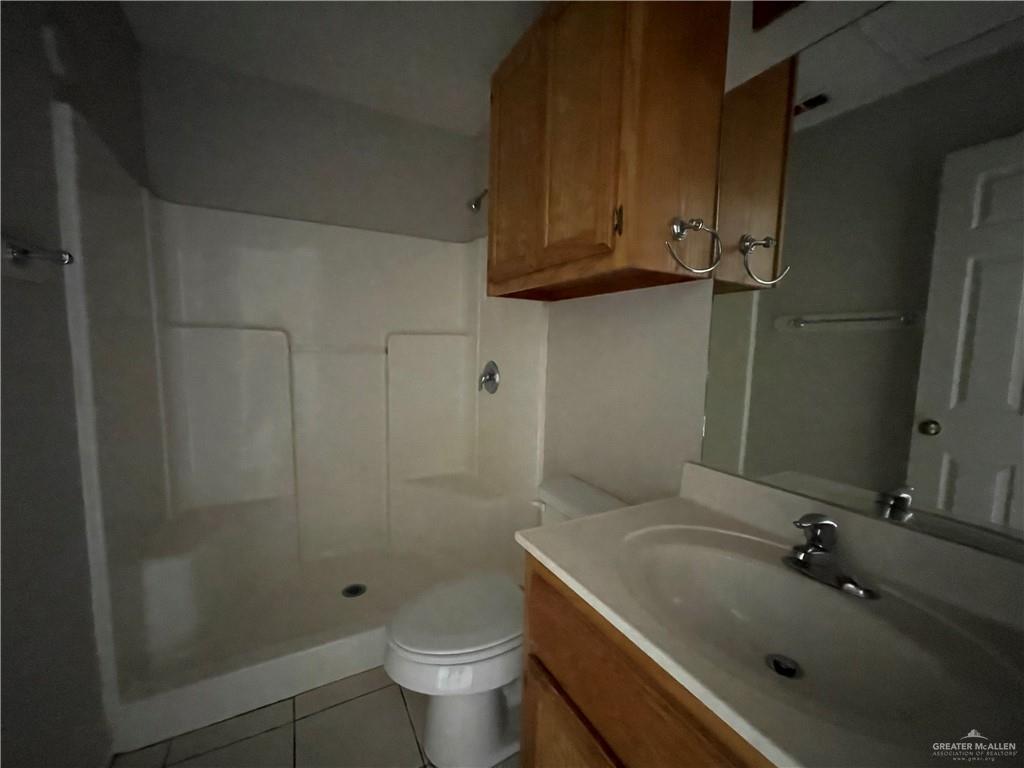 2311 Dora Jeanne, Unit A Mission, TX 78574 - Photo 7 of 9 a bathroom with a sink toilet and shower