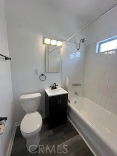 a bathroom with a sink toilet and bathtub