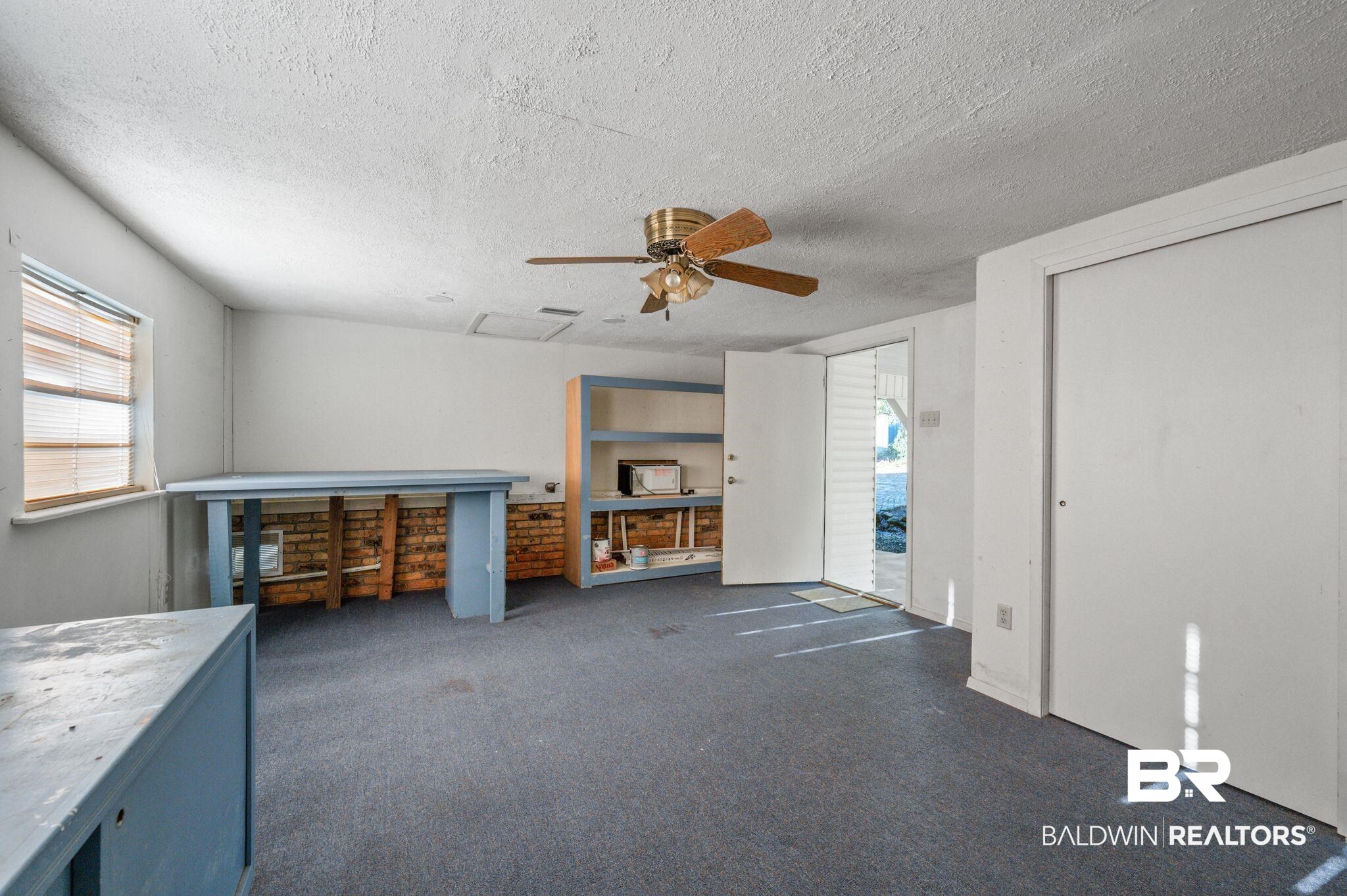 909 Caroline Avenue Daphne, AL 36526 - Photo 37 of 46 Interior space with ceiling fan, plenty of natural light, and a textured ceiling