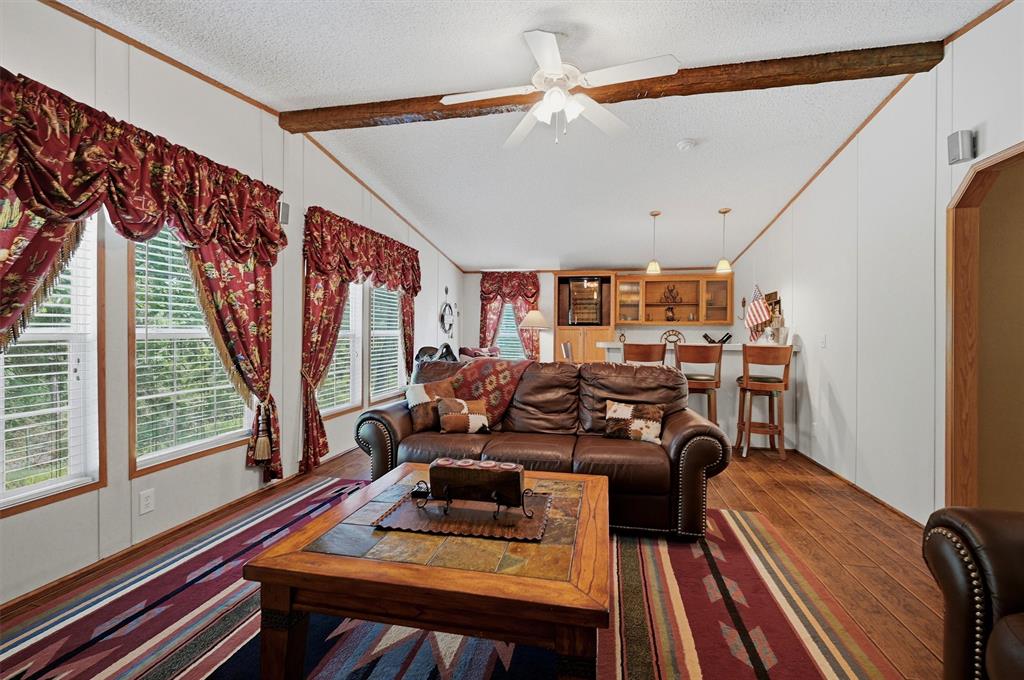 212 Sunset Road Pottsboro, TX 75076 - Photo 23 of 40 a bedroom with furniture and a large window