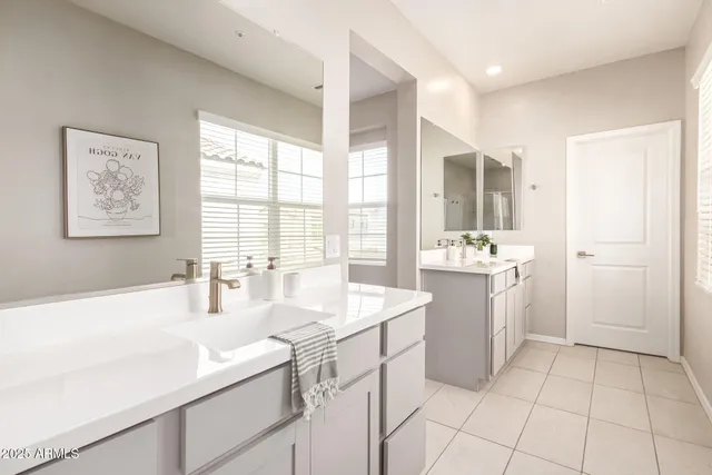 a kitchen with a sink cabinets and window