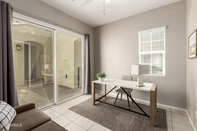 a workspace with furniture and window