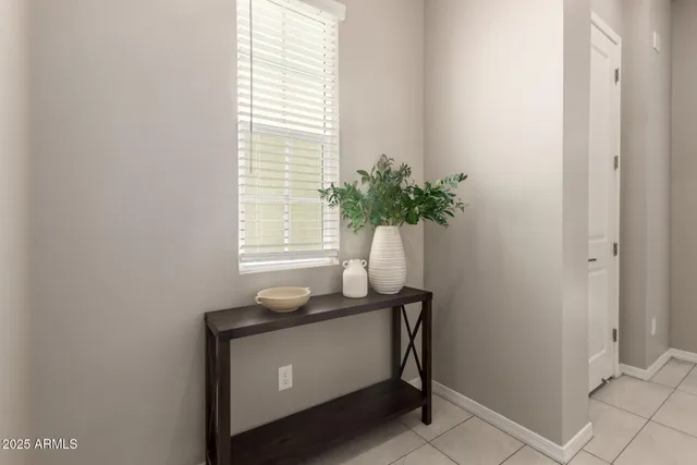 a room that has a window and a table in it