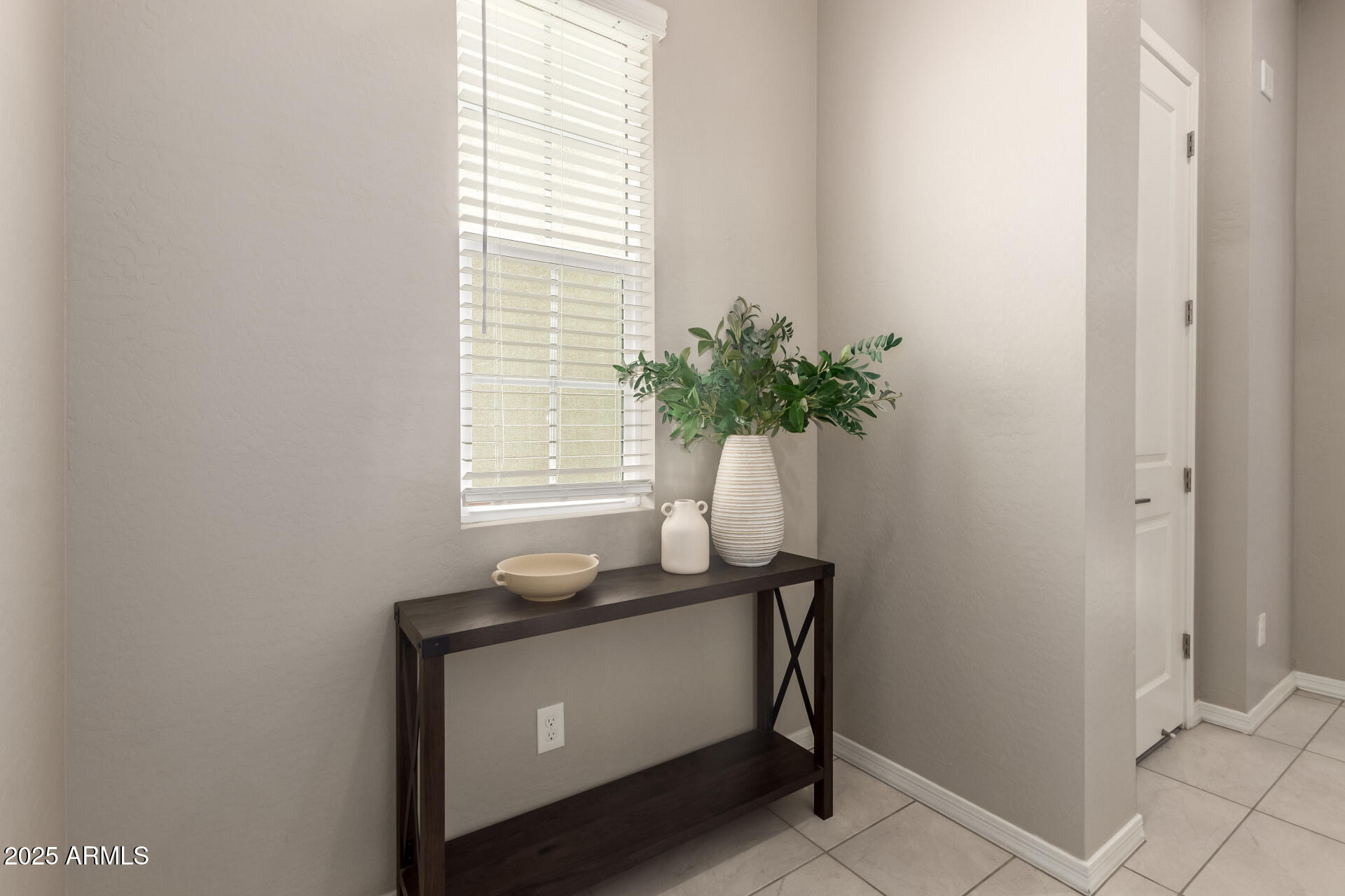 1535 East Dublin Street Gilbert, AZ 85295 - Photo 4 of 31 a room that has a window and a table in it