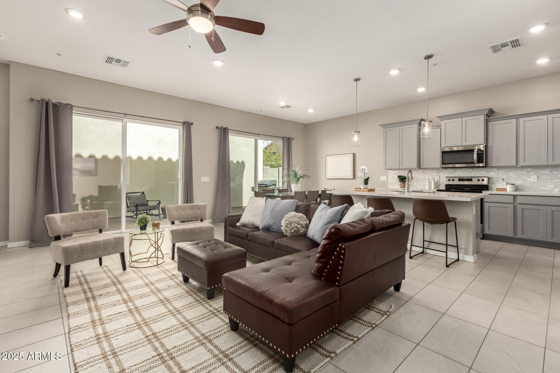 1535 East Dublin Street Gilbert, AZ 85295 - Photo 6 of 31 a living room with furniture and a large window