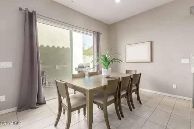a view of a dining room with furniture and a window
