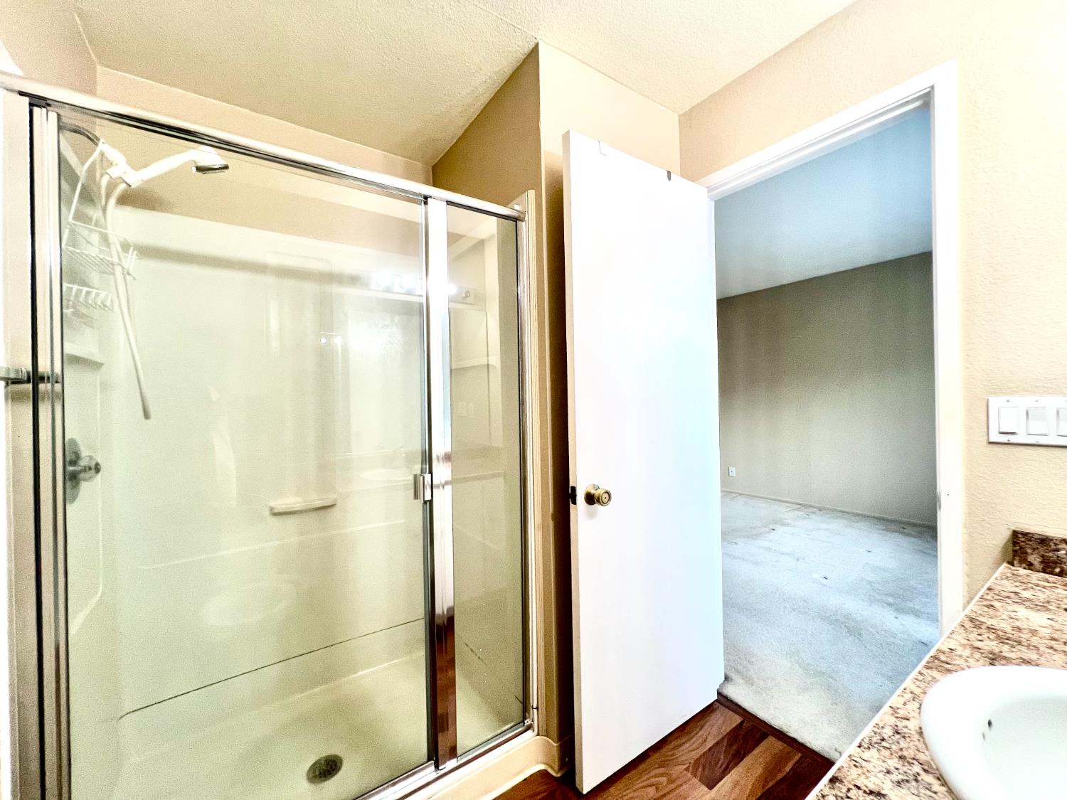14101 East 14th Street, Unit 104 San Leandro, CA 94578 - Photo 12 of 12 a bathroom with a glass shower door