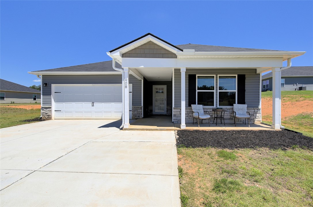 408 Chadwick Lane Walhalla, SC 29691 - Photo 2 of 44 A welcoming covered porch with space for seating enhances this home's inviting facade.