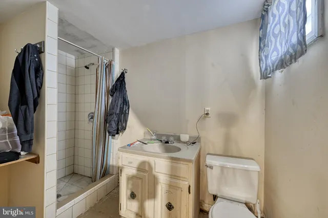 a bathroom with a bathtub and shower
