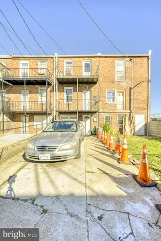 a view of a swimming pool with outdoor seating