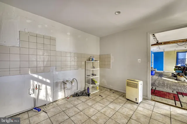 a bathroom with a bathtub and shower