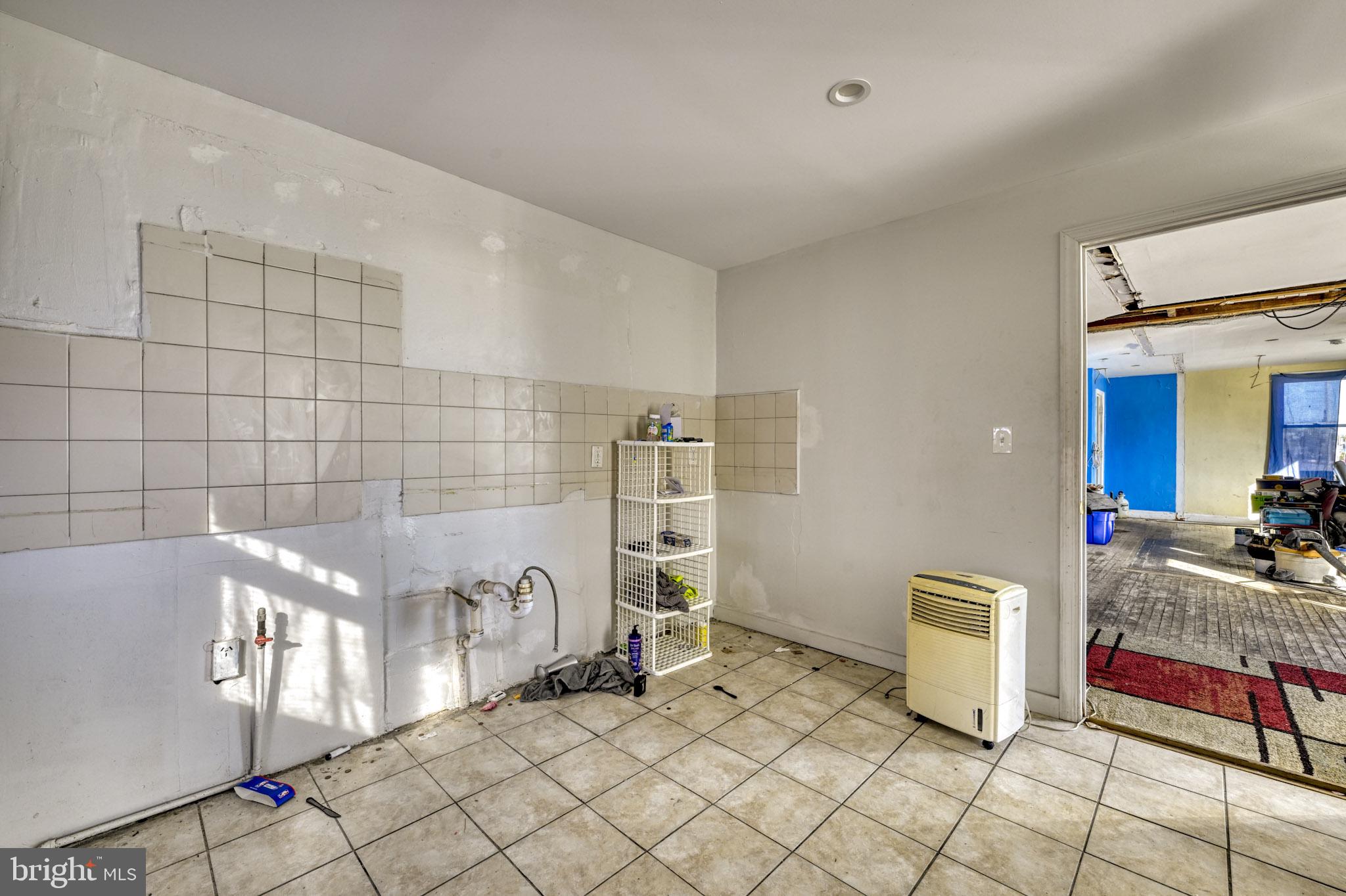 466 Hornel Street Baltimore, MD 21224 - Photo 5 of 19 a bathroom with a bathtub and shower