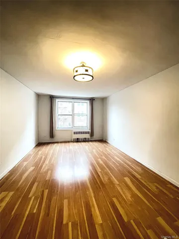 a view of an empty room and window