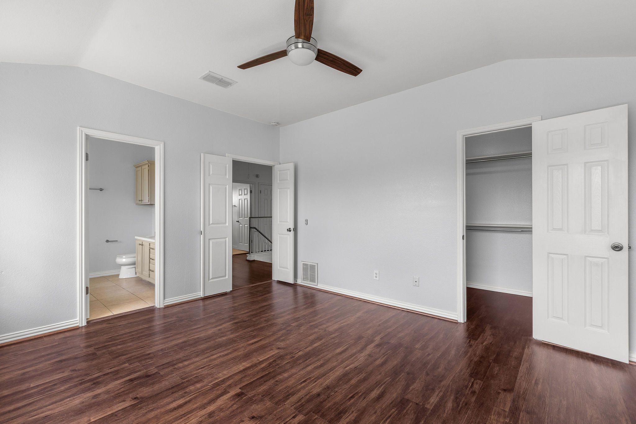 501 Shep Street Austin, TX 78748 - Photo 25 of 40 a view of an empty room with wooden floor and a ceiling fan