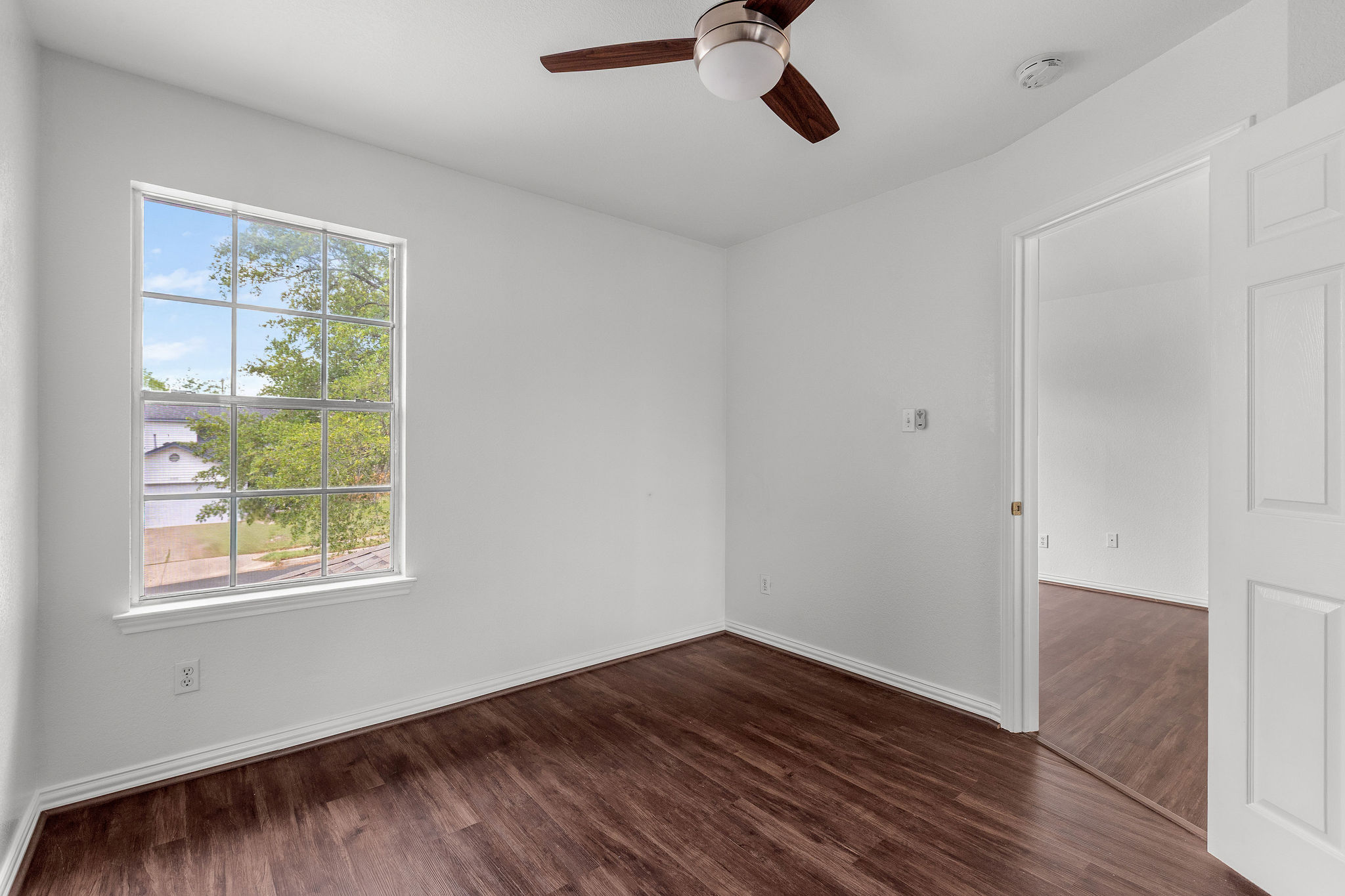 501 Shep Street Austin, TX 78748 - Photo 30 of 40 a view of an empty room with wooden floor and a window